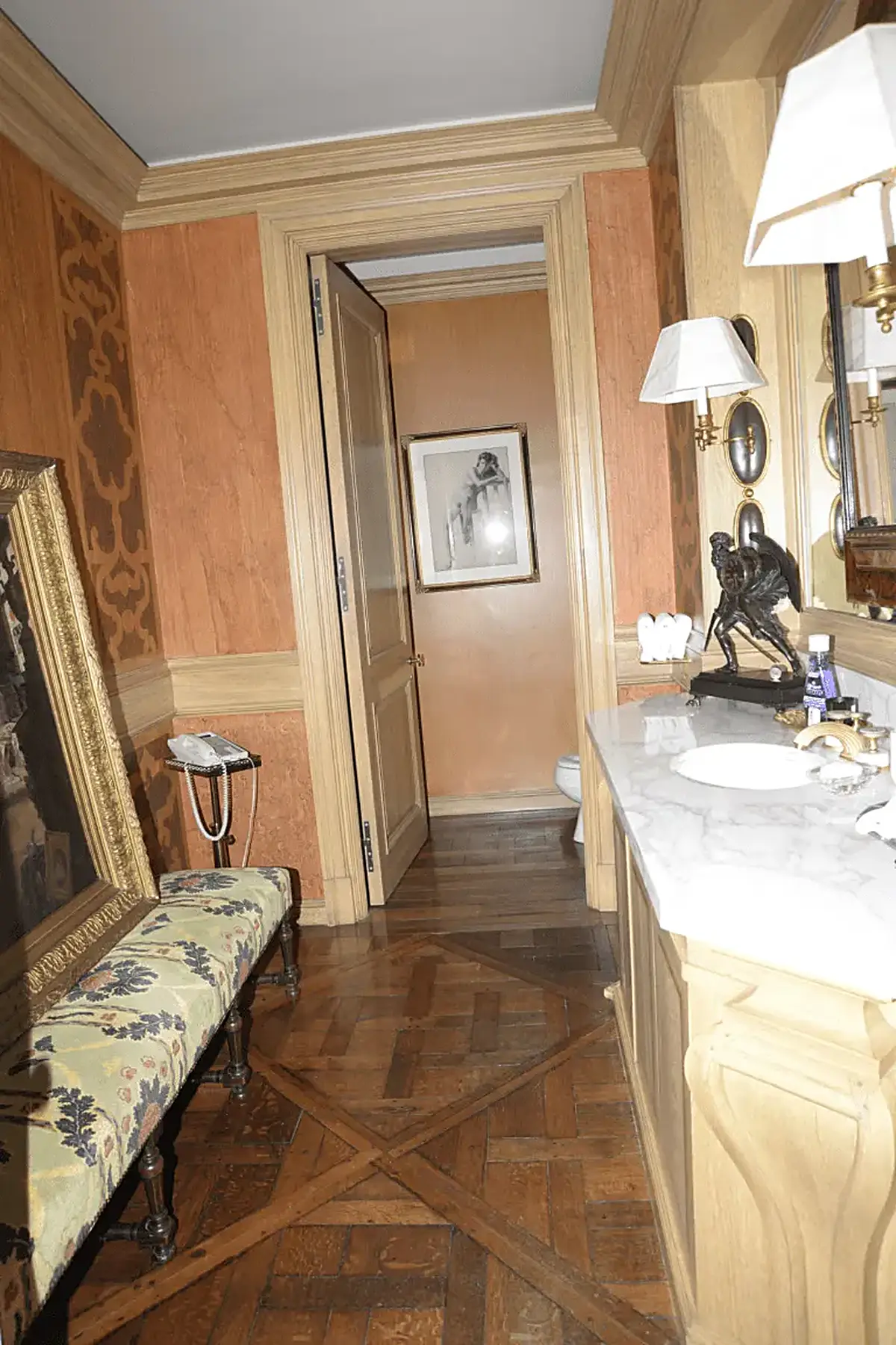 Salle de bains: EFTA00000685 - Luxurious bathroom with wooden floors ornate walls a marble countertop and 