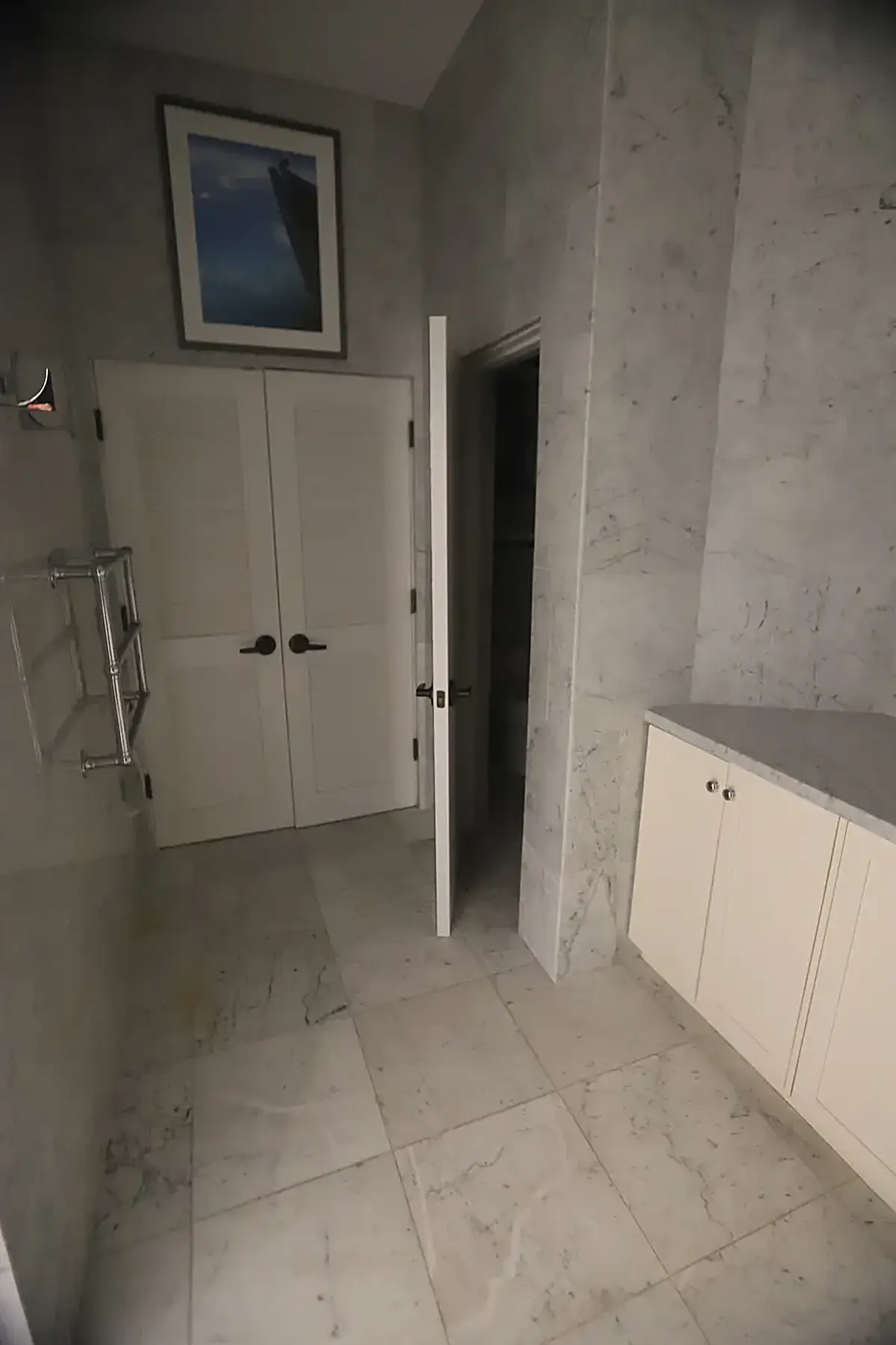 Ванная: USVI IMG 5424 - Modern bathroom with marble floors and walls white cabinets a framed pictu
