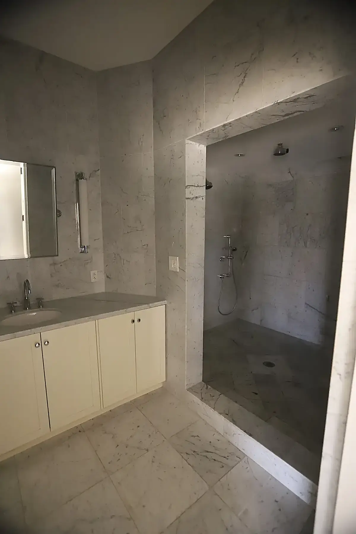 Bathroom: USVI IMG 5426 - Elegant marble bathroom with a sleek vanity and walk-in shower featuring p