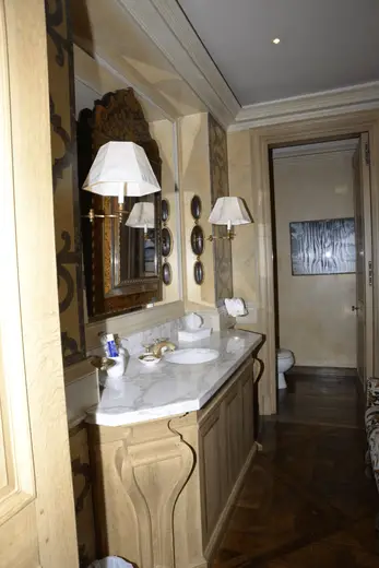Badezimmer: EFTA00000124 - Elegant bathroom with marble countertop ornate wooden vanity and classic wa