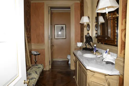 Ванная: EFTA00000138 - Luxurious bathroom with ornate wood paneling marble countertop and vintage-