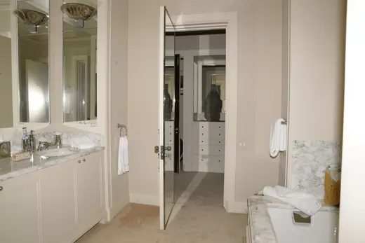 Ванная: EFTA00000274 - Modern bathroom with white cabinets marble countertops and large mirrors fe