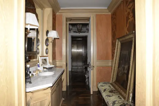 Ванная: EFTA00000143 - Elegant bathroom with marble countertop ornate mirror wooden cabinets and p
