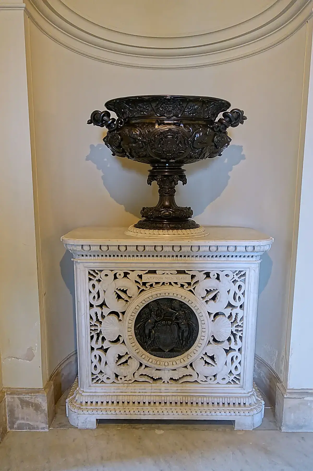 Surface detail: Urn atop Lorandini stove with Carlo Marochetti medallion based on Jean Goujon’s work at Ho